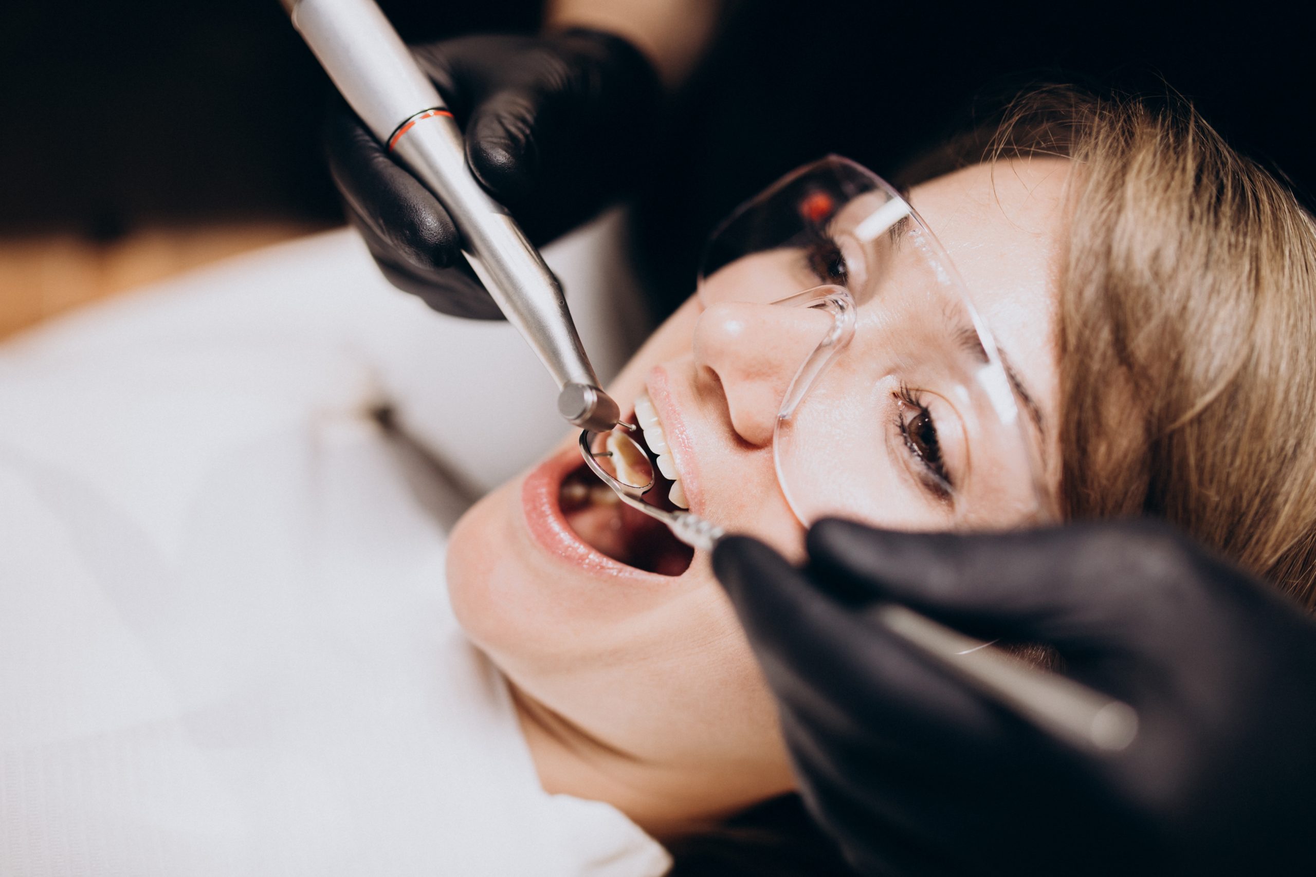woman-patient-visiting-dentist-scaled.jpg